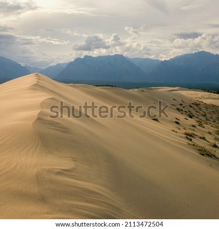 A landscape with mountains and mountain lake Royalty-Free Stock Photo #2113472504