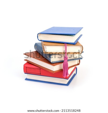 Stack of red, blue, yellow and brown books isolated on a white background