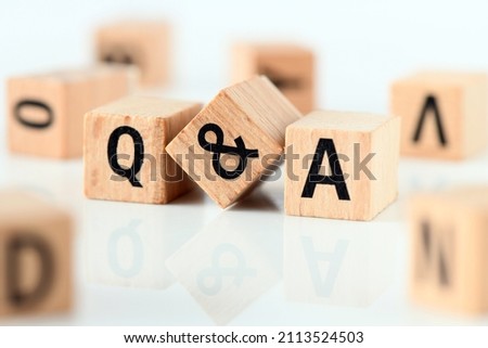 Q and A - short for question and answer. The word q and a arranged from wooden letters. 