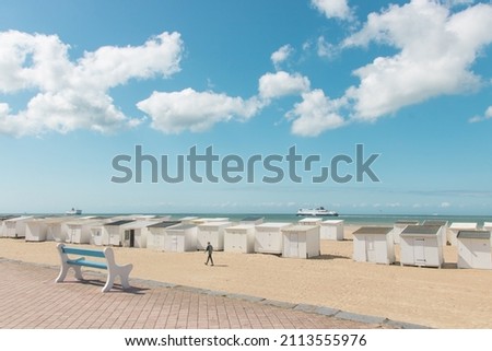 beach cabins on the Opal Coast in Calais Royalty-Free Stock Photo #2113555976