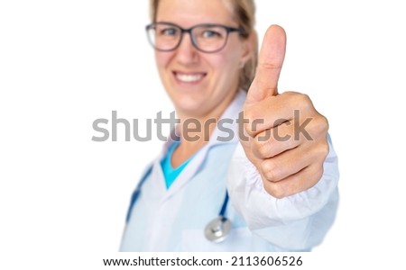 Young woman doctor showing thumbs up isolated on white background