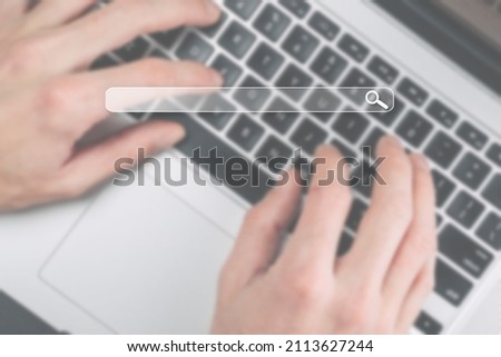 Search advertising. Internet online searching engine selective focus. Hand touching computer for data optimization browser webpage technology internet networking. Blured business concept