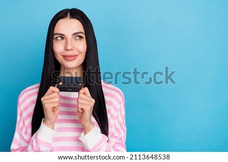Photo of young lovely lady wonder dream look empty space profit finance isolated over blue color background