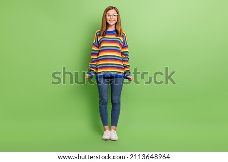 Full length body size view of attractive cheerful funny girl posing isolated on bright green color background