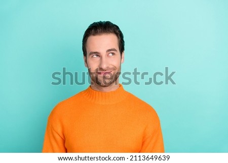 Photo of satisfied peaceful person look curious empty space isolated on pastel teal color background