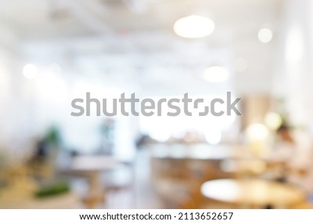 Interior of a minimalist design cafe blurred background.