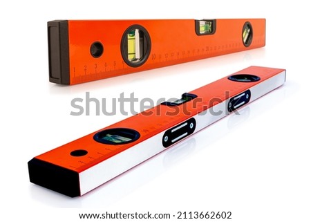 Yellow building level or water level meter with a ruler isolated on white background. Clipping path includes.