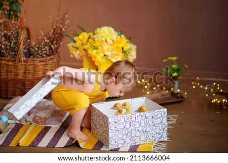  baby for easter, box with geese. High quality photo