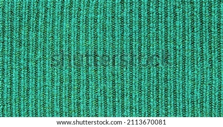 Green ribbed knit fabric texture as background
