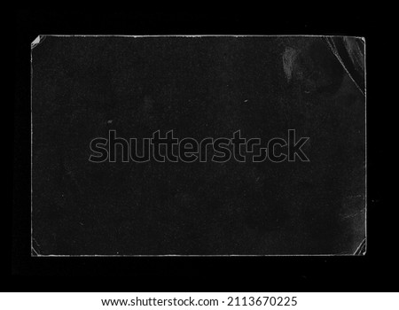 Old Black Empty Aged Damaged Paper Cardboard Photo Card Isolated on Black. Real Halftone Scan. Folded Edges. Rough Grunge Shabby Scratched Torn Ripped Texture. Distressed Overlay Surface for Collage.  Royalty-Free Stock Photo #2113670225