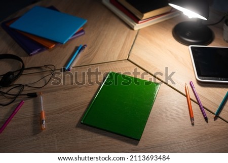 Student desk top view, teenager home workplace table with studying stationery tablet, textbooks