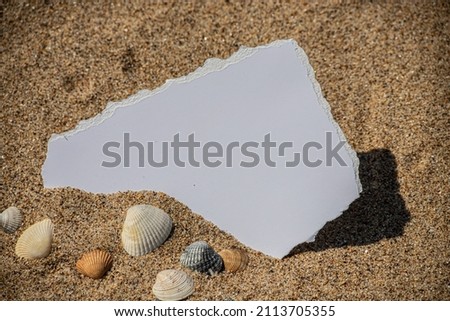 Summer style with empty blank paper card on a sea sand. summer card background for add text.