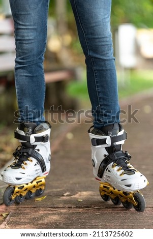 Close-up view of male legs in roller blades