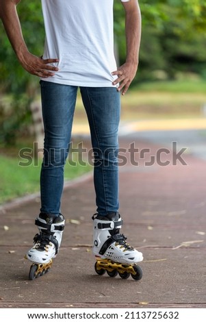 Close-up view of male legs in roller blades