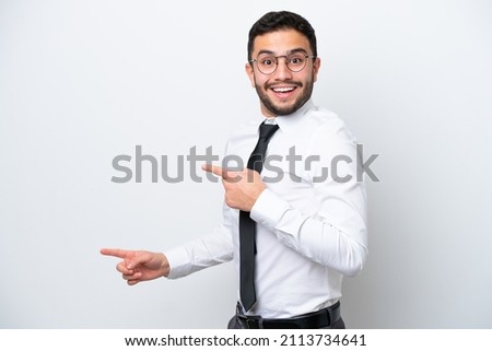 Business Brazilian man isolated on white background surprised and pointing side