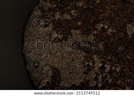 Abstract textured background transparent slime with bubbles inside. Macro of kids toy slime.