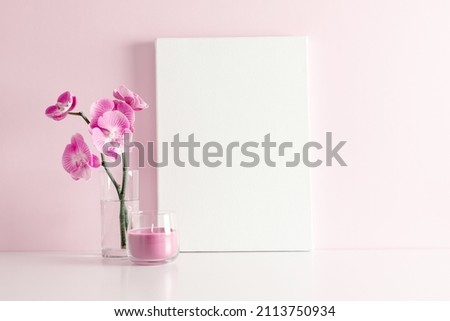 Beautiful flowers composition. Canvas, pink orchid flower on pastel pink background. Valentines Day, Happy Women's Day, copy space