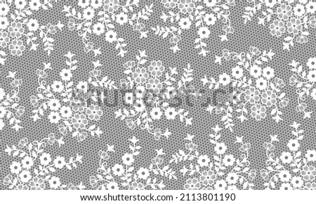 Bottomless lace material decorated with small bouquets of white flowers imitating a wedding veil.