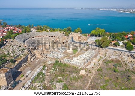 Ancient theater in Side. Turkey. Antalya. Ruins of the ancient city of Side. The largest amphitheater in Turkey. Main street of the ancient city. Mediterranean Sea. View from above. Side Royalty-Free Stock Photo #2113812956