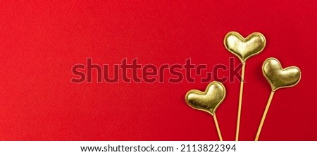Valentines day golden hearts on red background. 14th February, love, greeting concept, top view and copy space