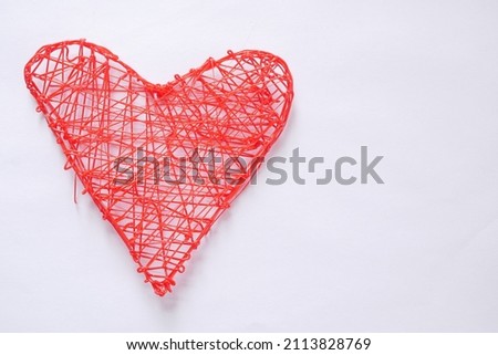 Heart made of plastic with 3d pen. Isolated on a white background.
