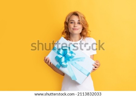 smiling redhead lady with giftbox. mothers day