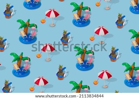 Trendy summer pattern made with various summer things on bright blur background. Minimal summer vacation concept.