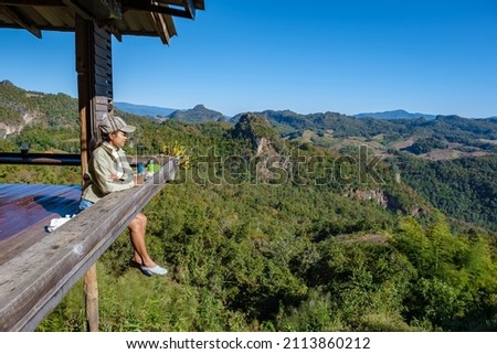 Mae Hong Son Thailand, Ban Jabo Noodle house, Ban Jabo, Mae Hong Son, Thailand. mountain view, morning mist Viewpoint Pha Mok Baan Jabo, in Mae Hong Son province woman relaxing in cafe