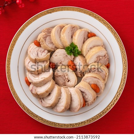 Top view of delicious sliced chicken roll soaked in Chinese wine named drunken shrimp for lunar new year's dishes. Royalty-Free Stock Photo #2113873592
