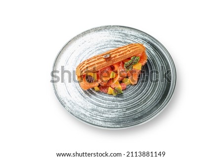 Homemade tuna sandwich in croissant with lettuce, pineapple in a plate on a white isolated background. Place for text. Fast Food. Menu layout image