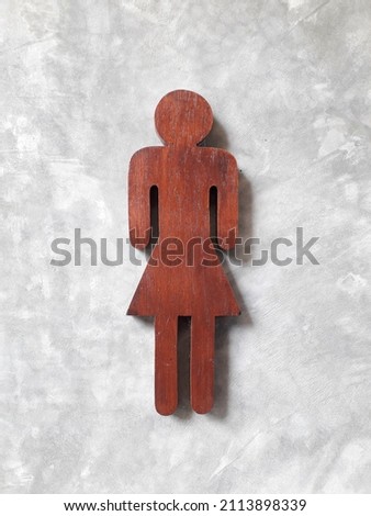 Symbol toilet on nature cement wall background