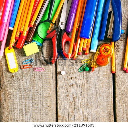 School tools. On a wooden background.