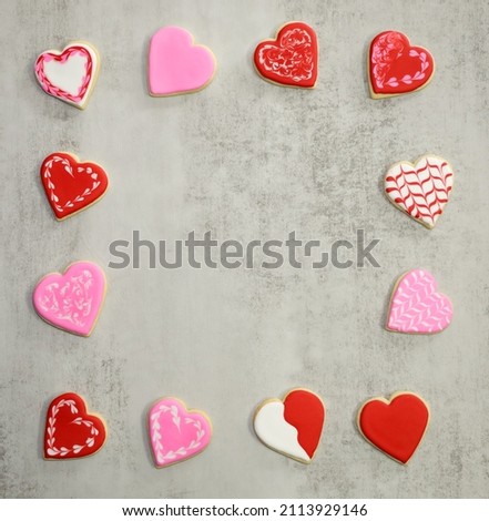 Valentines day background with frame made of sugar cookie hearts with royal icing.