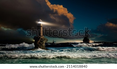 Storm at sea overlooking the lighthouse and ships. Lighthouse Tourlitis of Chora, Andros island, Cyclades, Greece