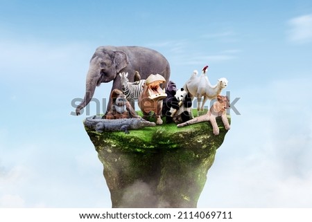 Image of wildlife animals on the green island with blue sky background. World wildlife day concept Royalty-Free Stock Photo #2114069711