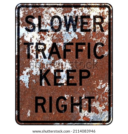 Old rusty American road sign - Slower traffic keep right