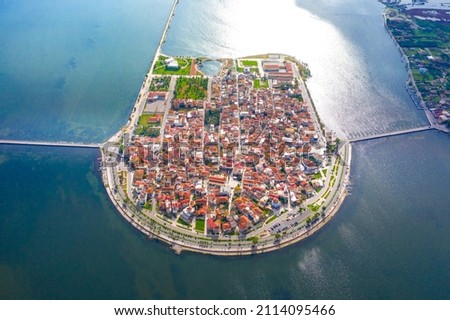 Aerial drone view of the famous island - fishing village of Aitoliko in Aetolia - Akarnania, Greece situated in the middle of Messolongi archipelago known as the Little Venice of Greece Royalty-Free Stock Photo #2114095466
