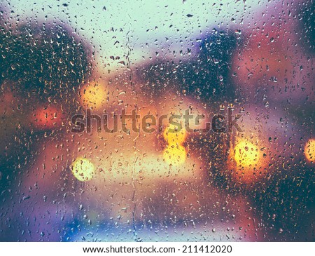 Drops Of Rain On Blue Glass Background. Street  Bokeh Lights Out Of Focus. Autumn Abstract Backdrop Royalty-Free Stock Photo #211412020