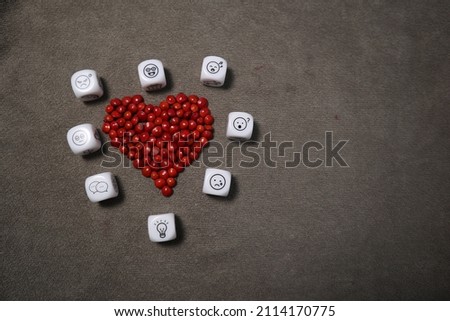 red heart and many picture dice design for love story and thinking