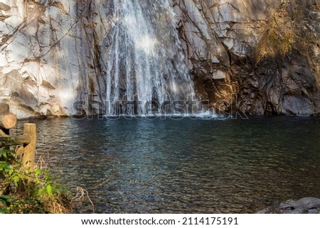 Waterfall water flowing down a rock wall