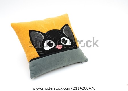 Cat pillow on a white background. Sewing.