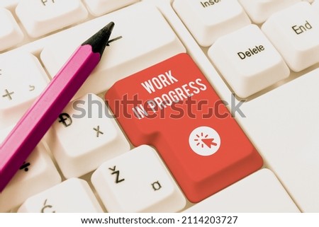 Conceptual caption Work In Progress. Business showcase Ongoing Business with teamwork, strategy, and cooperation Typing Product Ingredients, Abstract Presenting Upgraded Keyboard Royalty-Free Stock Photo #2114203727