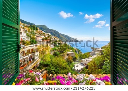 Mountain, city and sea view through an open window with shutters of the city of Positano on the Amalfi Coast of Southern Italy during summer.	 Royalty-Free Stock Photo #2114276225