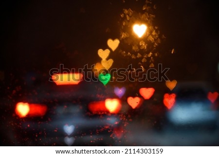 Night city lightis and car headlights in the shape of hearts. Bokeh. Valentine's Day, Love, romance concept. Background. Royalty-Free Stock Photo #2114303159