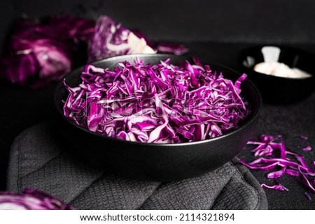Red cabbage on a dark background. Kohlrabi red cabbage salad with homemade mayonnaise. High quality photo Royalty-Free Stock Photo #2114321894