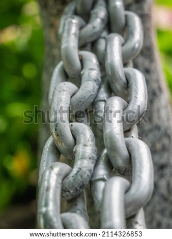 Silver colored metal chain with large links. 