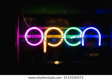 NEON Open Sign. Fluorescent Rainbow Colored Lights