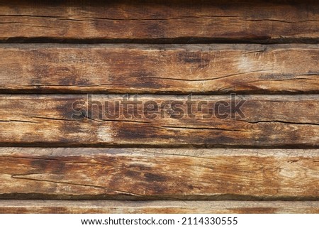 Wooden wall from log as background. Obsolete carpentry boards, panel. Surface of wooden texture for design and decoration. Dark brown horizontal wood plank grunge texture. Rustic backdrop. Copy space Royalty-Free Stock Photo #2114330555