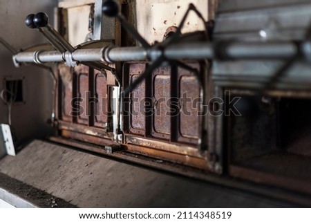 A picture of an oven in an abandoned psychiatric hospital