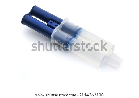 Two component epoxy adhesive on an isolated white background Royalty-Free Stock Photo #2114362190